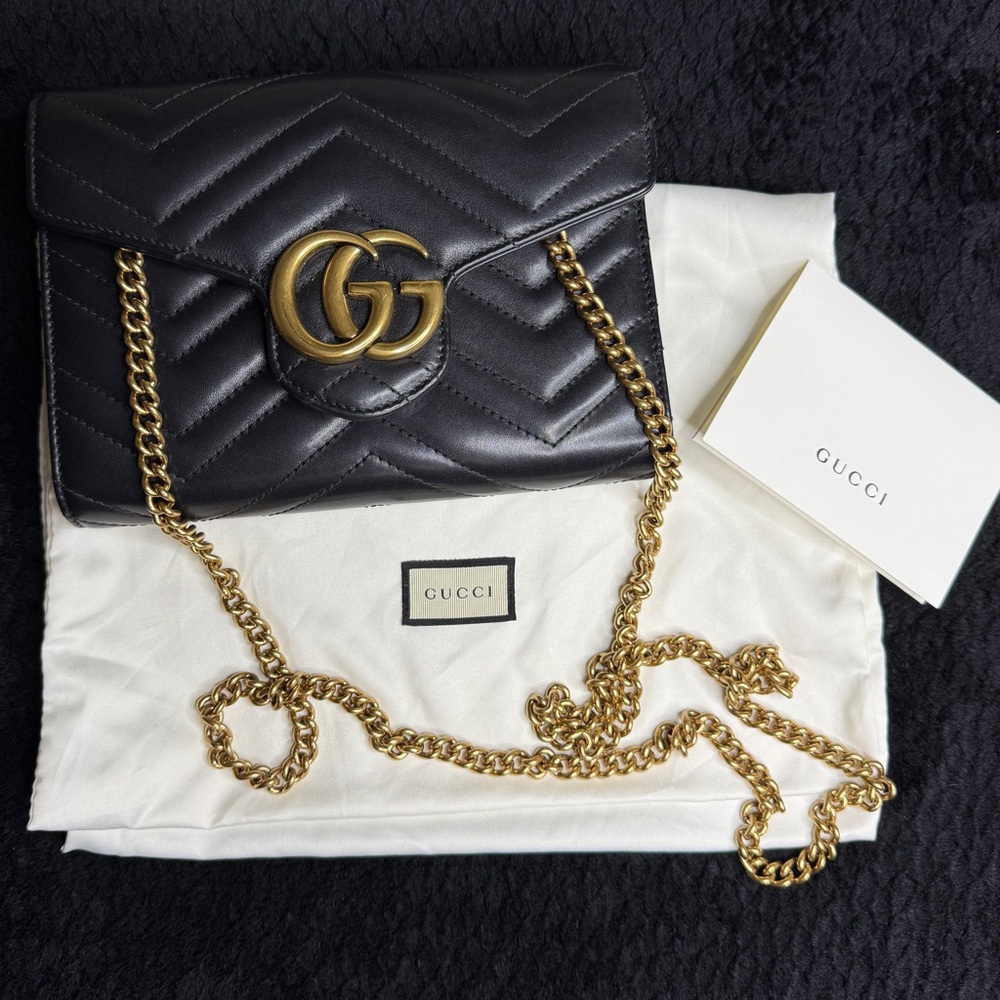 Gucci Black Leather Clutch with Gold Accents